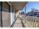 A covered porch provides shade and a relaxing outdoor space for this condo unit with parking lot views at 8335 Fairmount Dr # 4-102, Denver, CO 80247