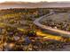 Aerial view of community near green space and highway at 7332 Woodglen Pl, Castle Pines, CO 80108