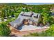Aerial view of the home, showcasing its landscaping and wooded surroundings at 7332 Woodglen Pl, Castle Pines, CO 80108