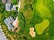 Aerial view of house and neighborhood near golf course at 7332 Woodglen Pl, Castle Pines, CO 80108