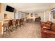 Spacious finished basement features a bar, TV, home theater, and large seating area at 7332 Woodglen Pl, Castle Pines, CO 80108