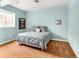 Comfortable bedroom with carpeted flooring, soft lighting, and a large window at 7332 Woodglen Pl, Castle Pines, CO 80108