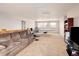 Large, versatile bonus room with ample space for recreation and entertaining, featuring neutral carpeting at 7332 Woodglen Pl, Castle Pines, CO 80108