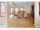 Elegant dining room with a large wooden table and chairs, carpet, and natural light at 7332 Woodglen Pl, Castle Pines, CO 80108