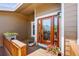 Charming front porch with decorative door and flowers, adding curb appeal at 7332 Woodglen Pl, Castle Pines, CO 80108