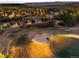 Golf course view from property with nearby houses nestled among the trees at 7332 Woodglen Pl, Castle Pines, CO 80108