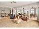 Open living area with seamless flow between spaces, providing ample natural light at 7332 Woodglen Pl, Castle Pines, CO 80108