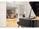 Open-concept living space showcasing elegant furnishings, hardwood floors and dining area at 7332 Woodglen Pl, Castle Pines, CO 80108