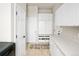 Well-organized mudroom with built-in storage, bench, and tile flooring at 7332 Woodglen Pl, Castle Pines, CO 80108