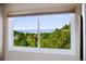 Scenic view of mountains and trees from a large window at 7332 Woodglen Pl, Castle Pines, CO 80108