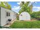 Backyard features a shed, grill, and landscaping; great for outdoor entertaining and storage at 4285 Newland St, Wheat Ridge, CO 80033