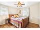 Bright bedroom with hardwood floors, ceiling fan, and natural light from two windows at 4285 Newland St, Wheat Ridge, CO 80033
