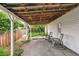 Covered patio with rocking chairs; ideal for relaxation and enjoying the outdoor space at 4285 Newland St, Wheat Ridge, CO 80033