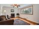 Bright living room featuring hardwood floors, bay window, a comfortable sofa, and natural light at 4285 Newland St, Wheat Ridge, CO 80033