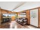 Relaxing living room with wood paneling, comfortable seating, and natural light at 4285 Newland St, Wheat Ridge, CO 80033