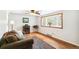 Bright living room with hardwood floors, bay window, and comfortable furnishings at 4285 Newland St, Wheat Ridge, CO 80033