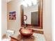 Bathroom with granite vanity and glass sink at 2020 Arapahoe St # 1070, Denver, CO 80205
