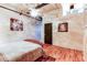Bedroom with hardwood floors and ceiling fan at 2020 Arapahoe St # 1070, Denver, CO 80205