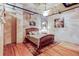Spacious bedroom with hardwood floors and ceiling fan at 2020 Arapahoe St # 1070, Denver, CO 80205