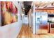 Light-filled hallway with hardwood floors at 2020 Arapahoe St # 1070, Denver, CO 80205