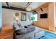 Spacious living room with sectional sofa, hardwood floors, and large windows offering natural light at 2020 Arapahoe St # 1070, Denver, CO 80205