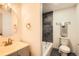 This is a bathroom with a tub and a vanity with updated fixtures at 4445 Milwaukee St, Denver, CO 80216