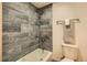 A stylish bathroom featuring gray tiling in the tub and shower area at 4445 Milwaukee St, Denver, CO 80216