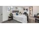 Comfortable bedroom featuring plush gray carpet, a luxurious bed, and modern decor at 4445 Milwaukee St, Denver, CO 80216