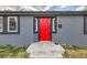 Charming single-story home featuring a vibrant red front door and freshly painted exterior at 4445 Milwaukee St, Denver, CO 80216