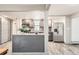 This is a kitchen with stainless steel appliances, gray cabinets and a breakfast bar at 4445 Milwaukee St, Denver, CO 80216