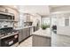 Contemporary kitchen featuring sleek appliances, updated cabinets, and open layout at 4445 Milwaukee St, Denver, CO 80216