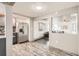 A kitchen that opens to a living room with great lighting at 4445 Milwaukee St, Denver, CO 80216