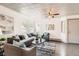 Inviting living room with plenty of natural light, hardwood floors, and comfortable furniture at 4445 Milwaukee St, Denver, CO 80216