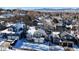 Aerial view of a residential neighborhood with houses covered in snow at 6765 Tabor St, Arvada, CO 80004