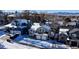 Aerial view of a residential neighborhood with houses covered in snow at 6765 Tabor St, Arvada, CO 80004