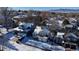 Aerial view of a residential neighborhood with houses covered in snow at 6765 Tabor St, Arvada, CO 80004