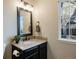 Elegant bathroom with granite vanity and updated fixtures at 6765 Tabor St, Arvada, CO 80004