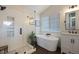 Elegant bathroom with soaking tub, walk-in shower, and modern vanity at 6765 Tabor St, Arvada, CO 80004