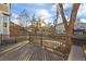 Private deck with string lights, overlooking backyard and neighborhood at 6765 Tabor St, Arvada, CO 80004