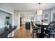 Kitchen with white cabinets, an island, and a breakfast nook at 6765 Tabor St, Arvada, CO 80004