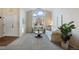 Living room with two sofas, a coffee table, and a large window, showcasing natural light at 6765 Tabor St, Arvada, CO 80004