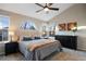 Main bedroom with a ceiling fan and plenty of closet space at 6765 Tabor St, Arvada, CO 80004