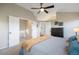 Main bedroom with access to en-suite bathroom and loft at 6765 Tabor St, Arvada, CO 80004