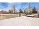 View of a fenced backyard with a large deck, perfect for entertaining outdoors at 10532 Wintersweet Ct, Parker, CO 80134