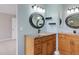 Updated bathroom vanity featuring granite countertop and decorative mirrors at 10532 Wintersweet Ct, Parker, CO 80134