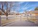 View from the cozy outdoor deck, showcasing the neighborhood and blue skies at 10532 Wintersweet Ct, Parker, CO 80134