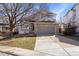 Charming two-story home featuring a stone-accented facade, well-kept lawn, and an attached two-car garage at 10532 Wintersweet Ct, Parker, CO 80134