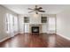 Cozy living room showcases a stone fireplace, built-in shelves, and natural light at 10532 Wintersweet Ct, Parker, CO 80134