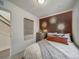 Charming bedroom with terracotta wall and hanging tapestry at 12940 E 103Rd Ave, Commerce City, CO 80022