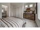 Bright bedroom with ensuite bathroom and walk-in closet at 12940 E 103Rd Ave, Commerce City, CO 80022